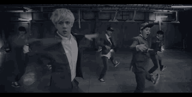 A gid showing the kpop group EXO dancing to their 2013 hit, Growl